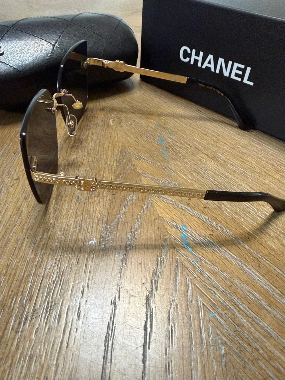 CHANEL Rimless Square Sunglasses in Dark Gradient with Gold Accents